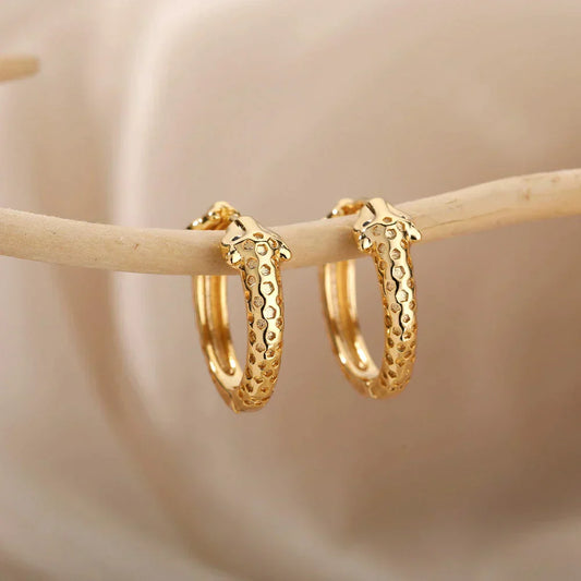 Boucles d'oreilles minimalistes en forme de serpent en or
